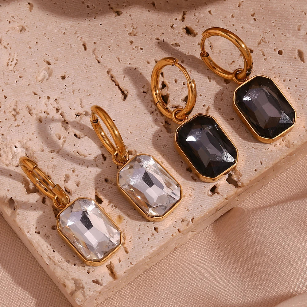 The Precious Earrings in white and black flat lay