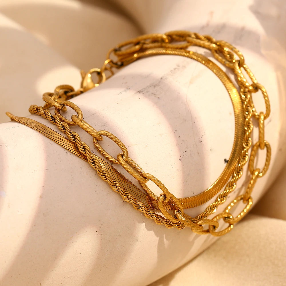 A waterproof bracelet made of three unique gold chains 