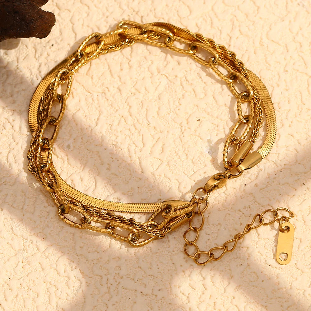 A waterproof bracelet made of three unique gold chains 
