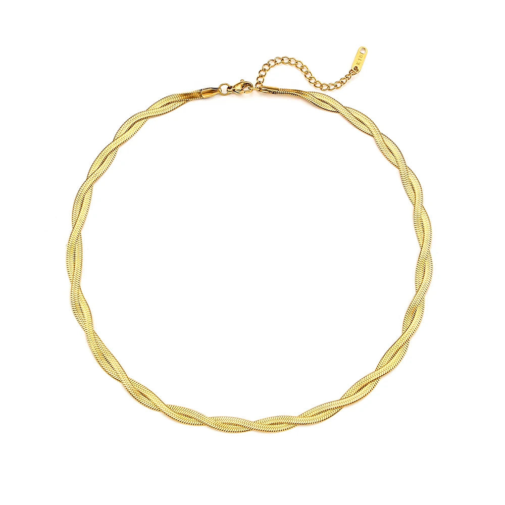 A gold twisted snake chain Necklace made from 18K gold plated stainless steel, flat layed on a white background.