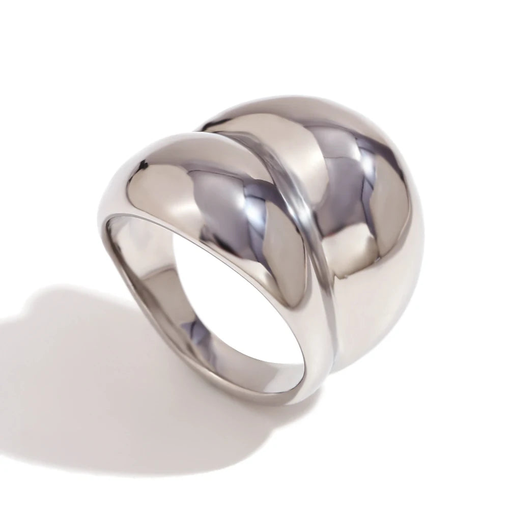Silver chunky stainless steel ring with a smooth, flowing design, symbolizing strength and connection.