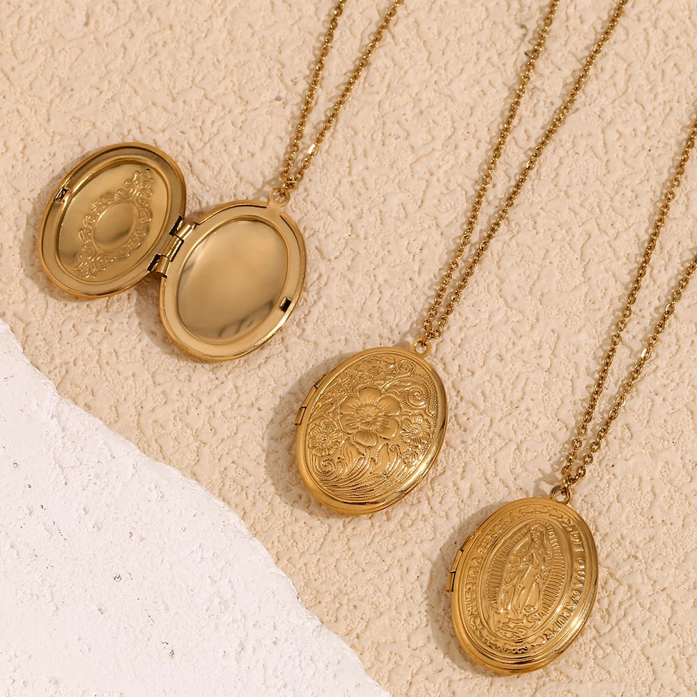 Oval-shaped gold-plated locket necklaces with vintage-inspired engravings, opening