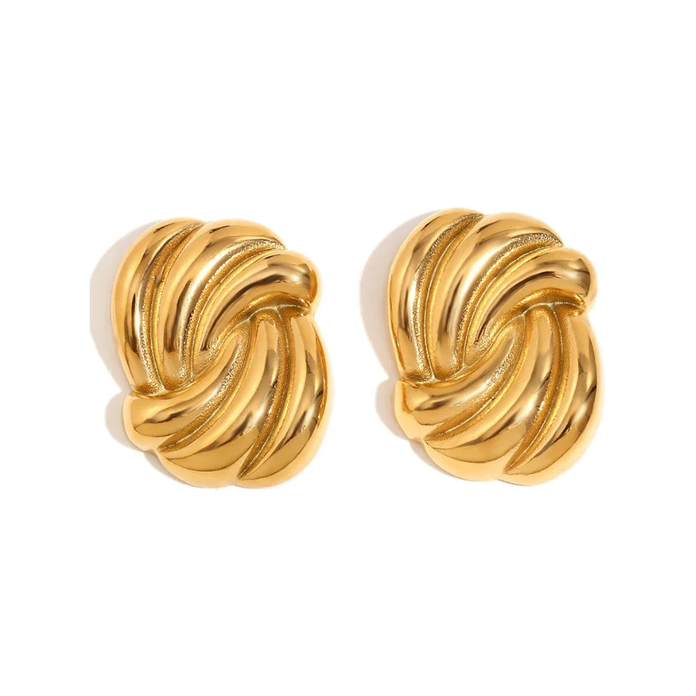 A pair of timeless gold earrings with a twisted design, crafted from 18K gold plated stainless steel.