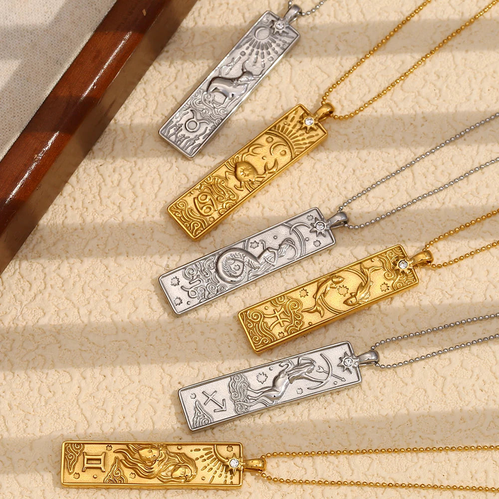 Zodiac Tag Necklaces flat lay