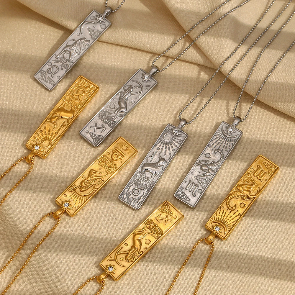 Zodiac Tag Necklaces flat lay
